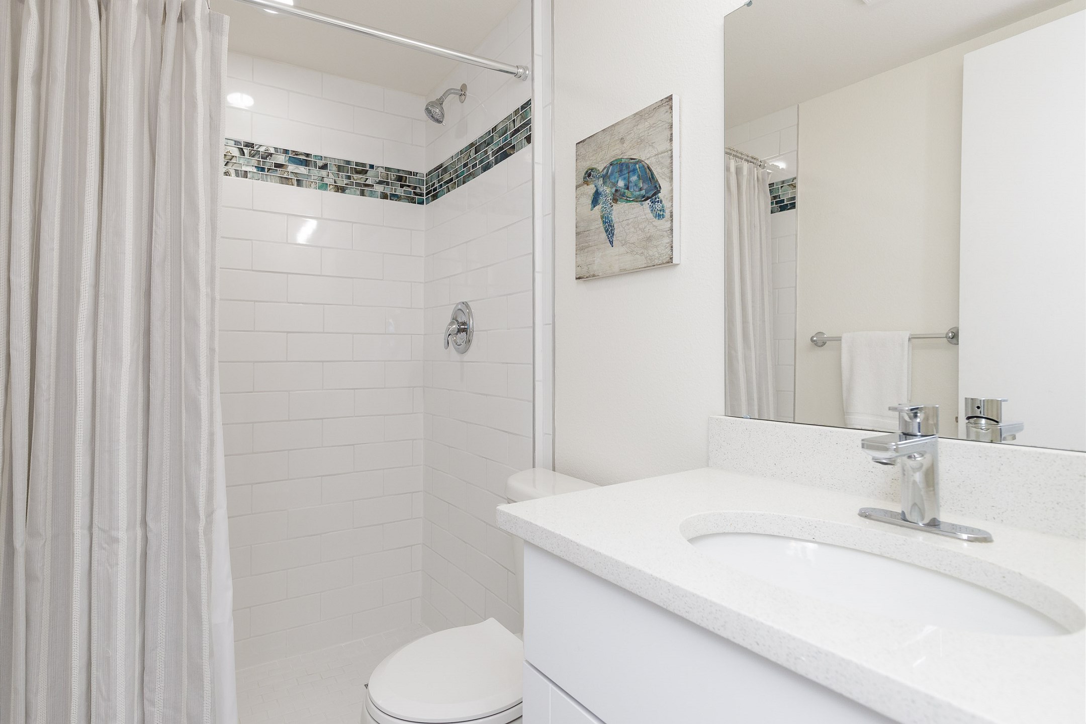Master bathroom with a walk-in shower and coastal charm 