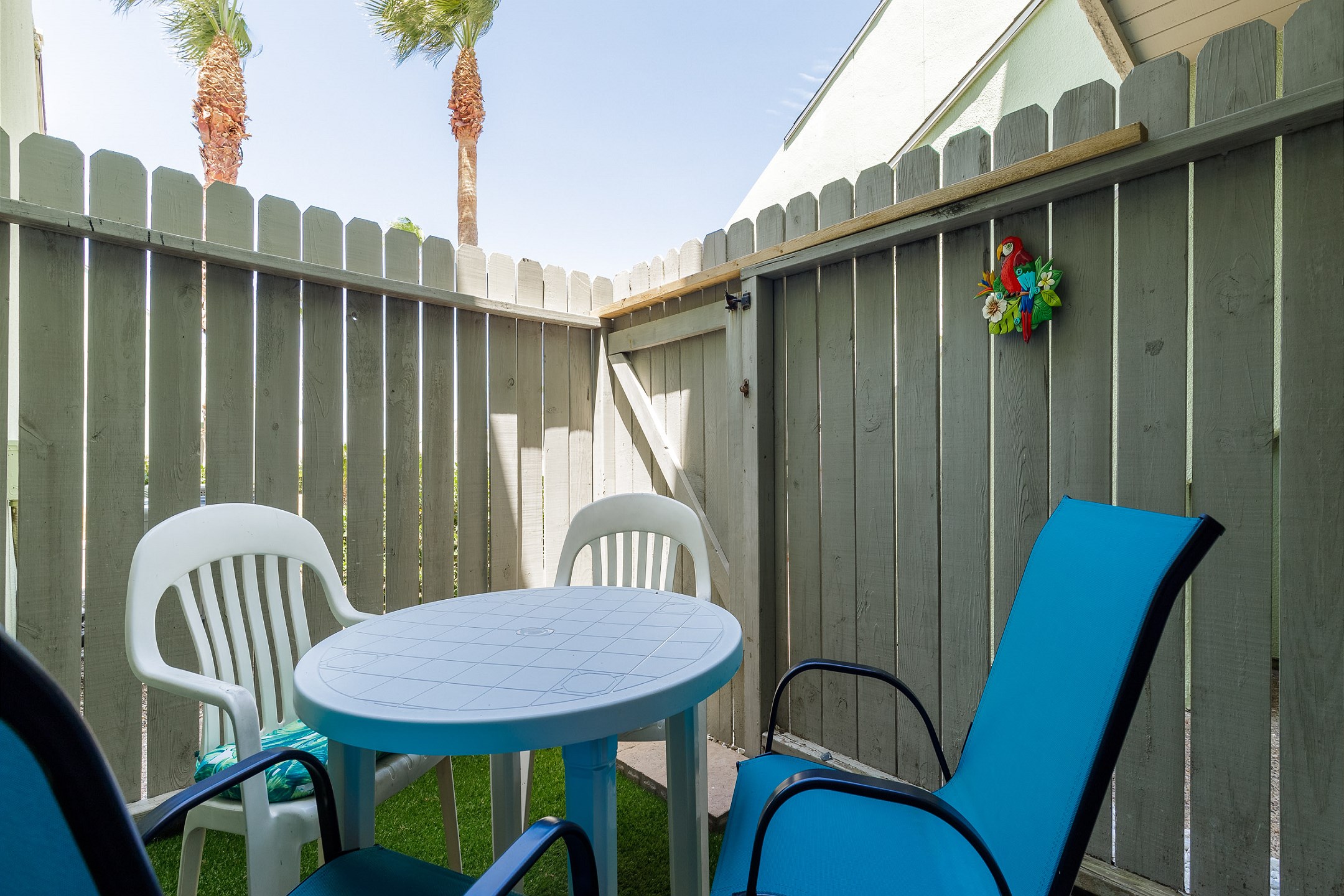 A fun hangout spot on the shared patio off the second and third bedrooms, complete with a table and chairs for relaxing or chatting