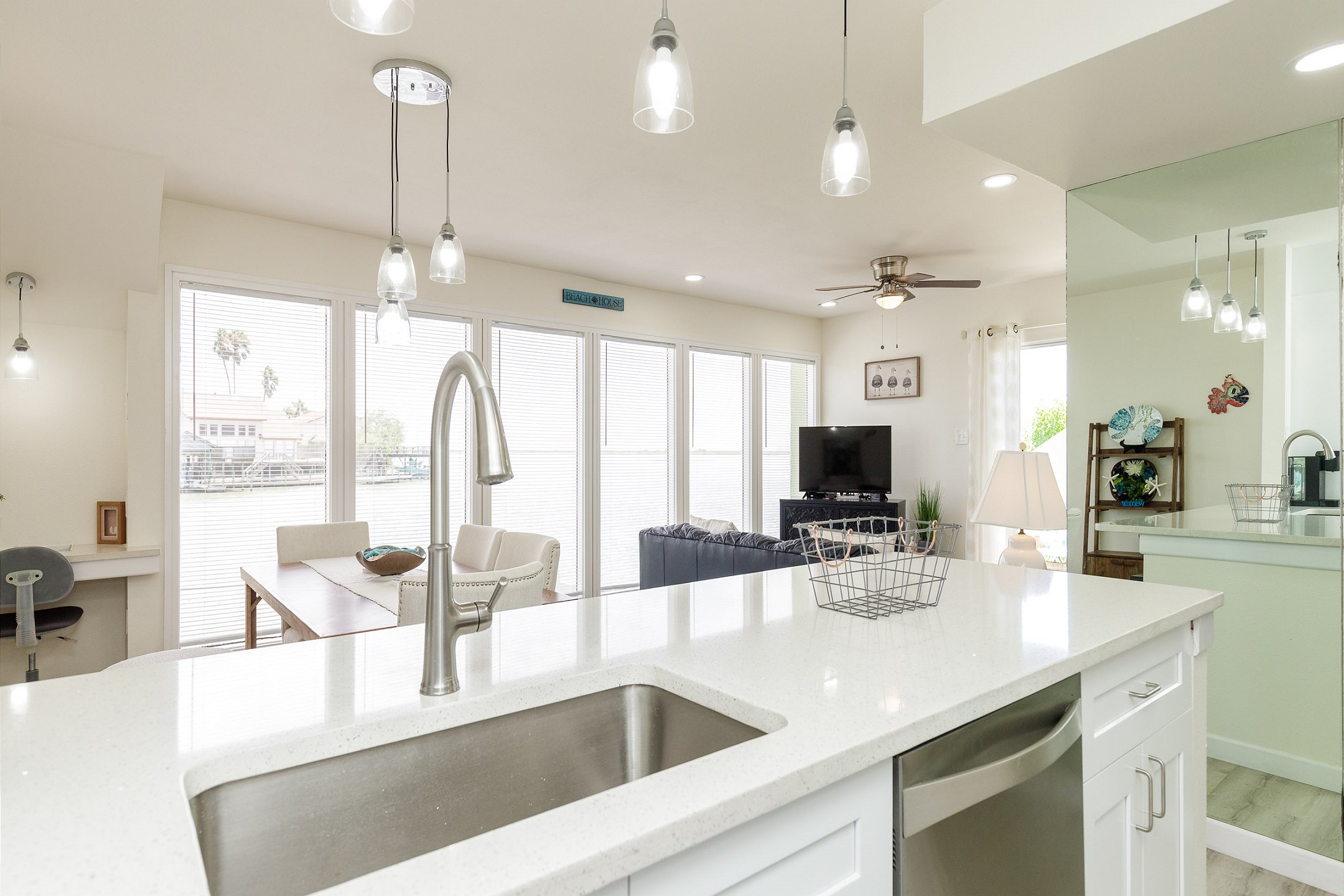 Sleek modern kitchen boasting granite countertops and ample space for preparing a full meal