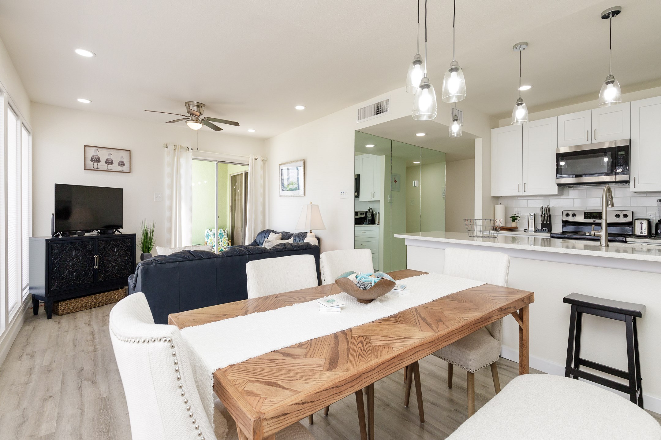 Open concept dining, kitchen and living area for family gatherings 