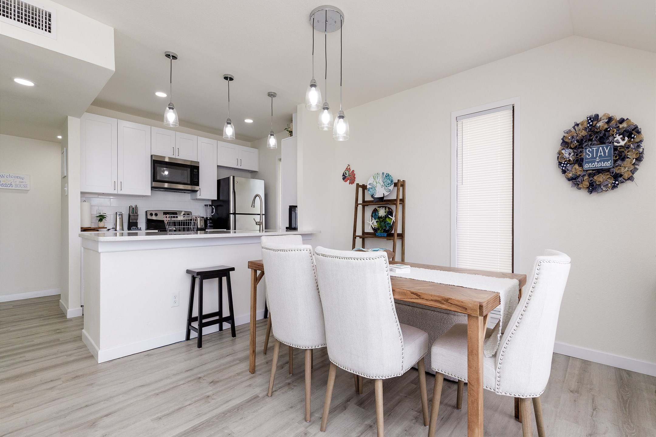 Dining table with seating for four and a bench