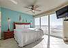 Master bedroom with king size bed, private bathroom and a privacy wall that opens and closes up to the living area 