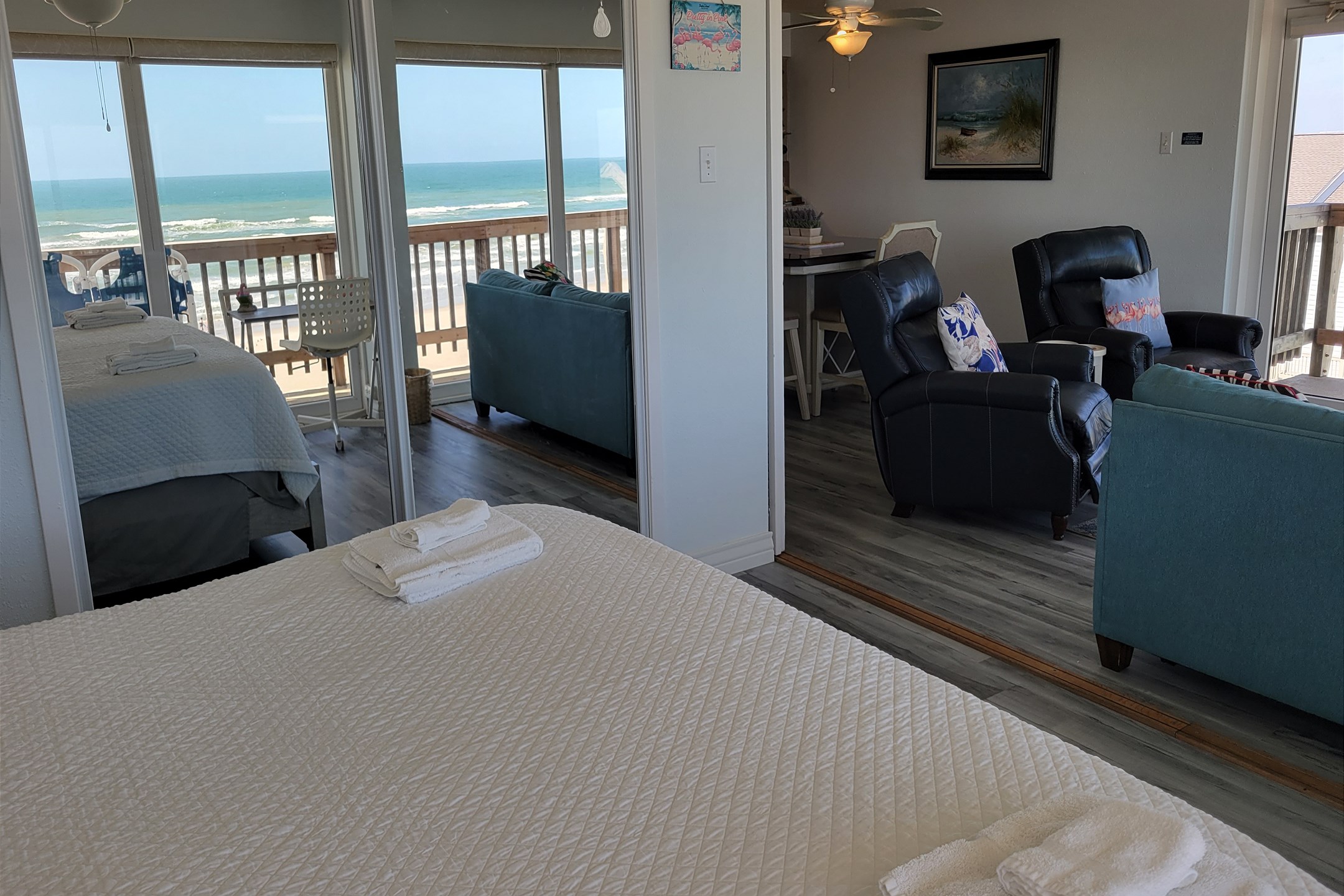 Master bedroom with king size bed, private bathroom and a privacy wall that opens and closes up to the living area 