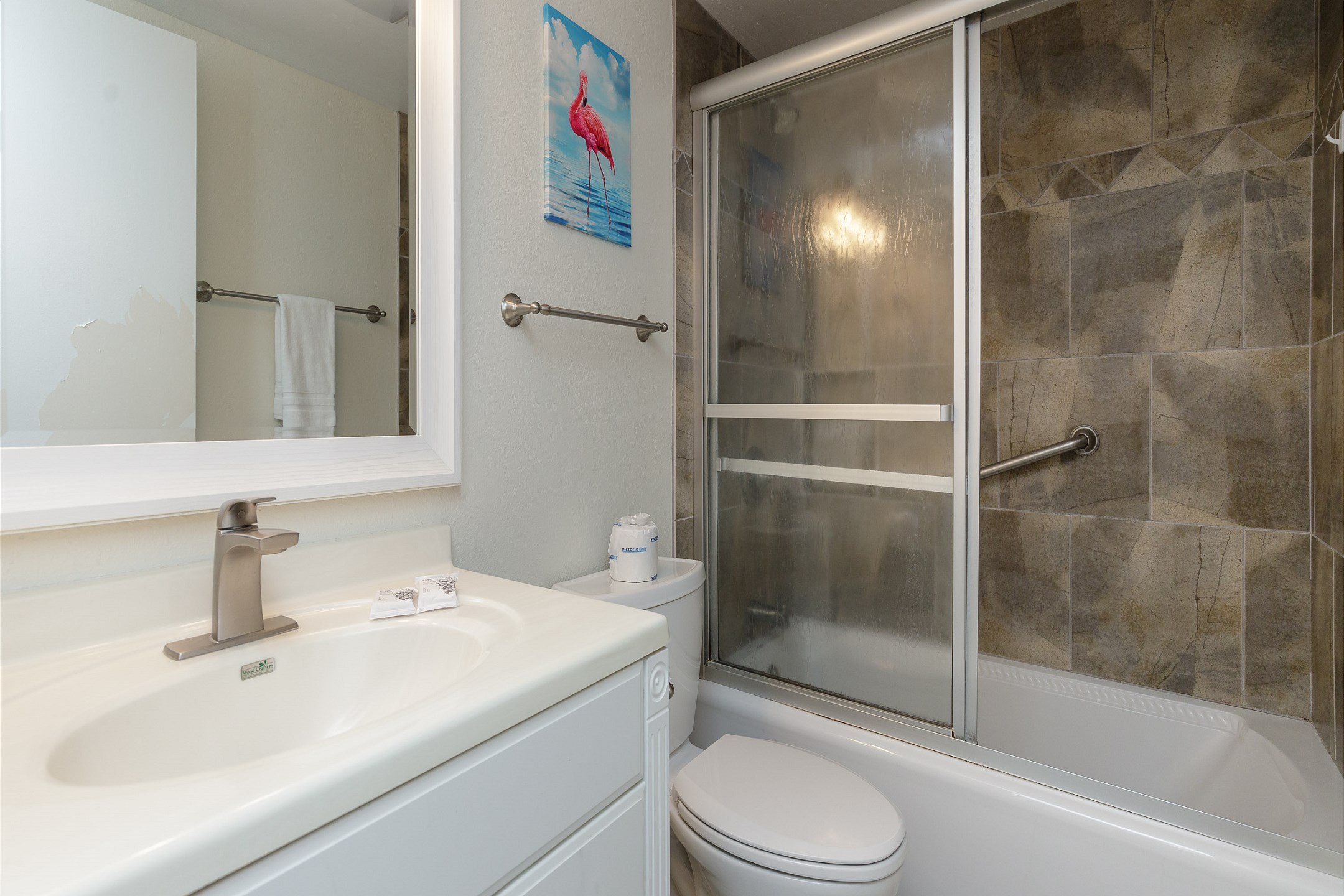 Guest bathroom with tub and shower