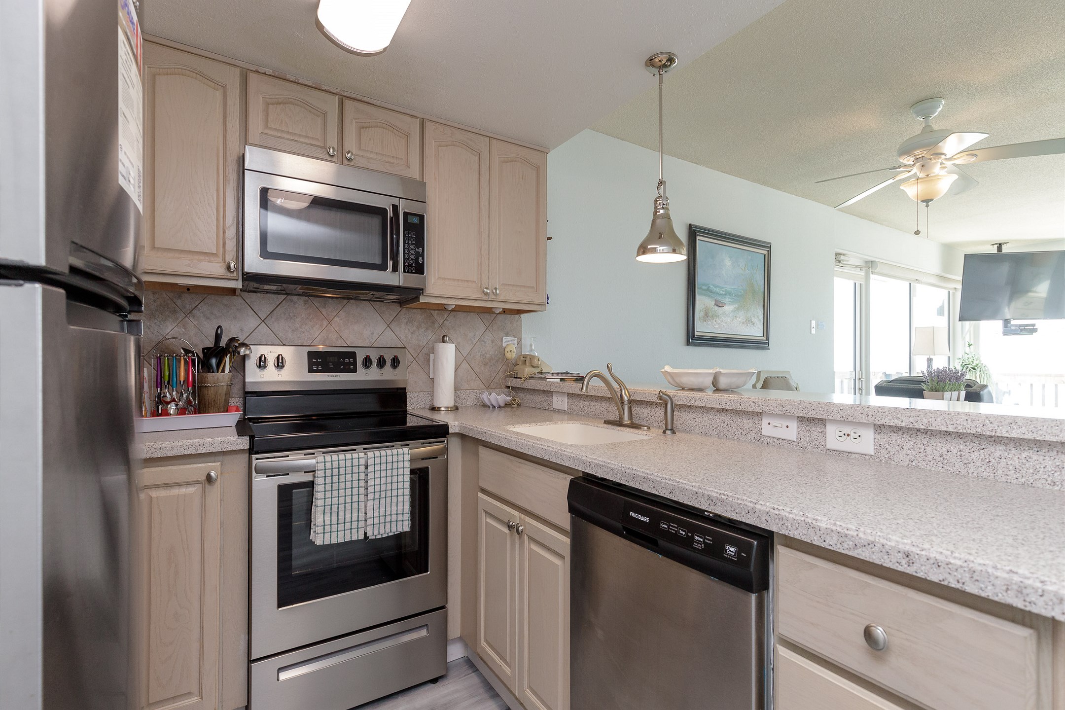 Kitchen area with stainless steel appliances 