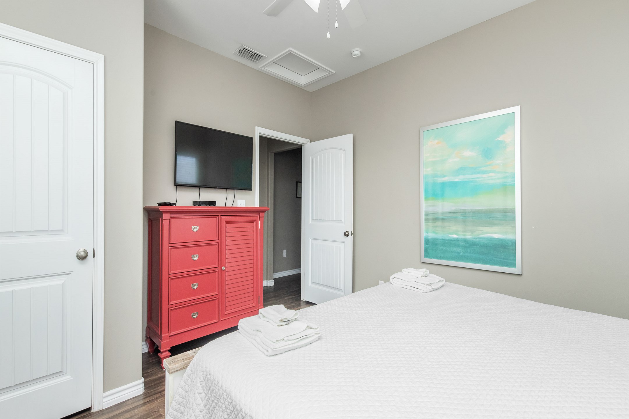 Fifth bedroom on the third floor with king size bed and flat screen TV