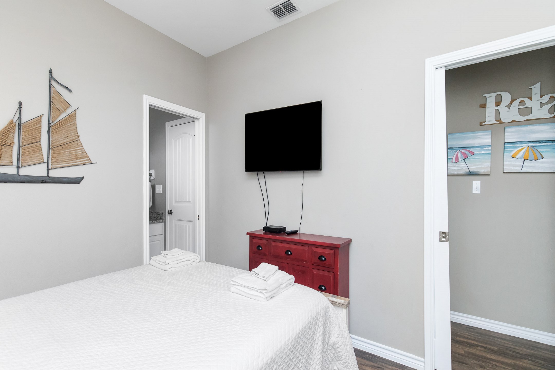 Third bedroom on the second floor with queen size bed, shared bathroom, private balcony and flat screen TV