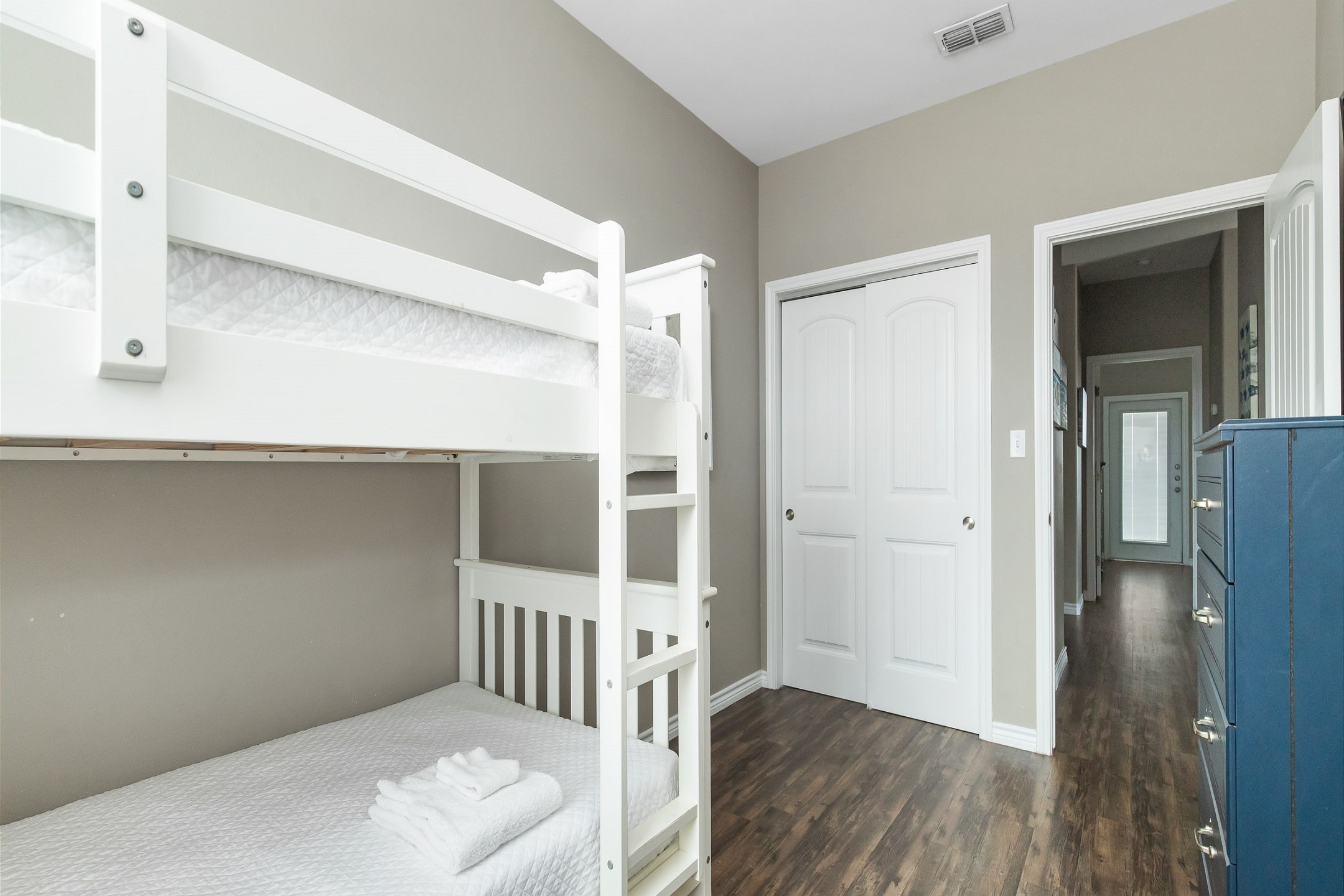 Fourth bedroom on the second floor with twin over twin size bunk bed, shared bathroom and flat screen TV