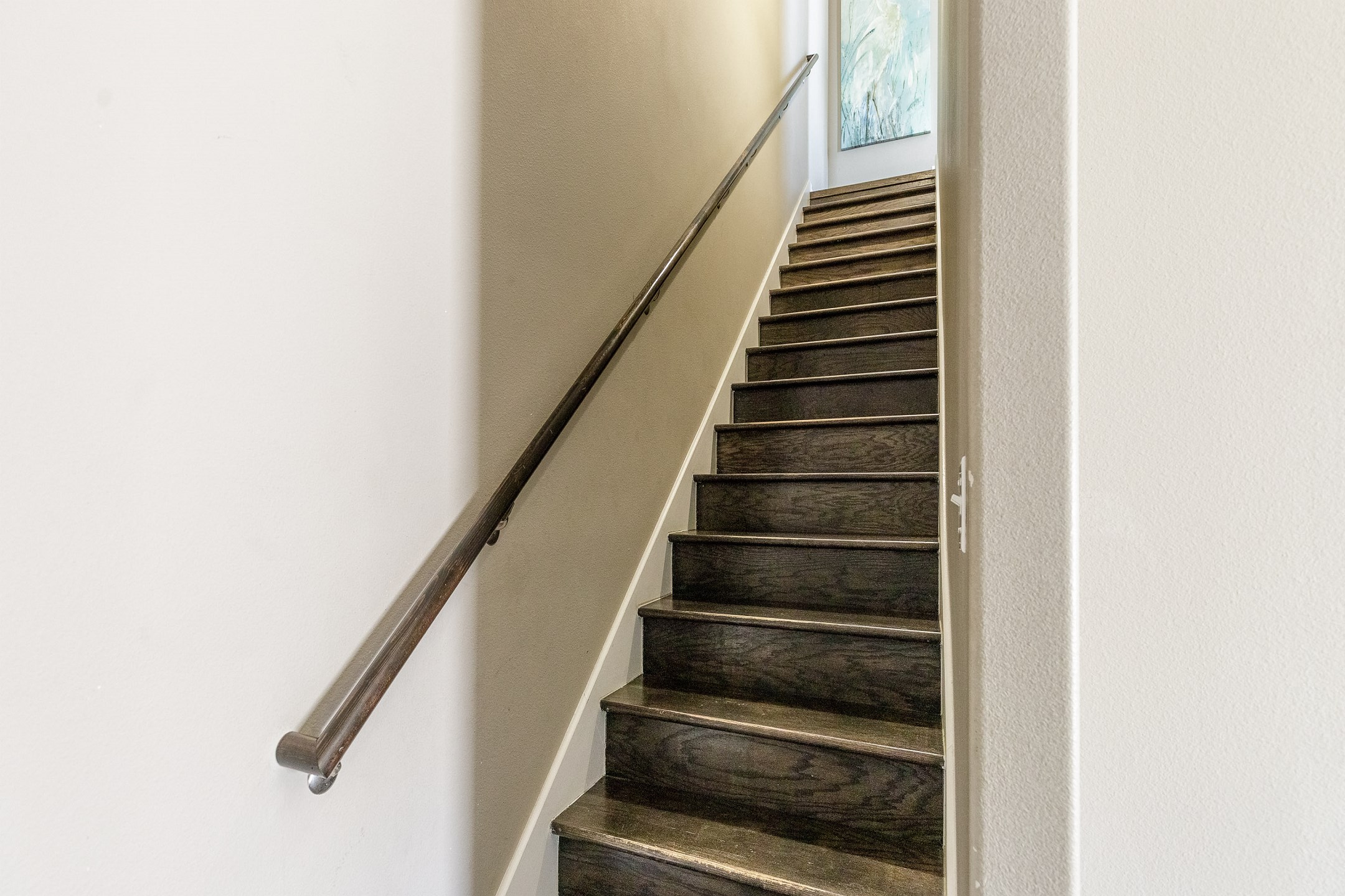 Stairway from the second floor to the living and kitchen space on the third floor