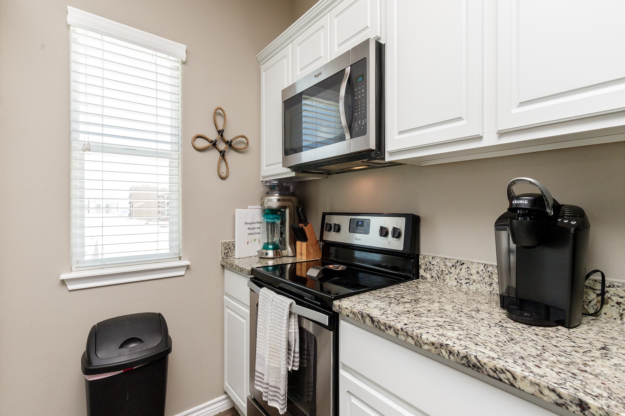Kitchen space with Keurig coffee maker, toaster, and other essentials provided