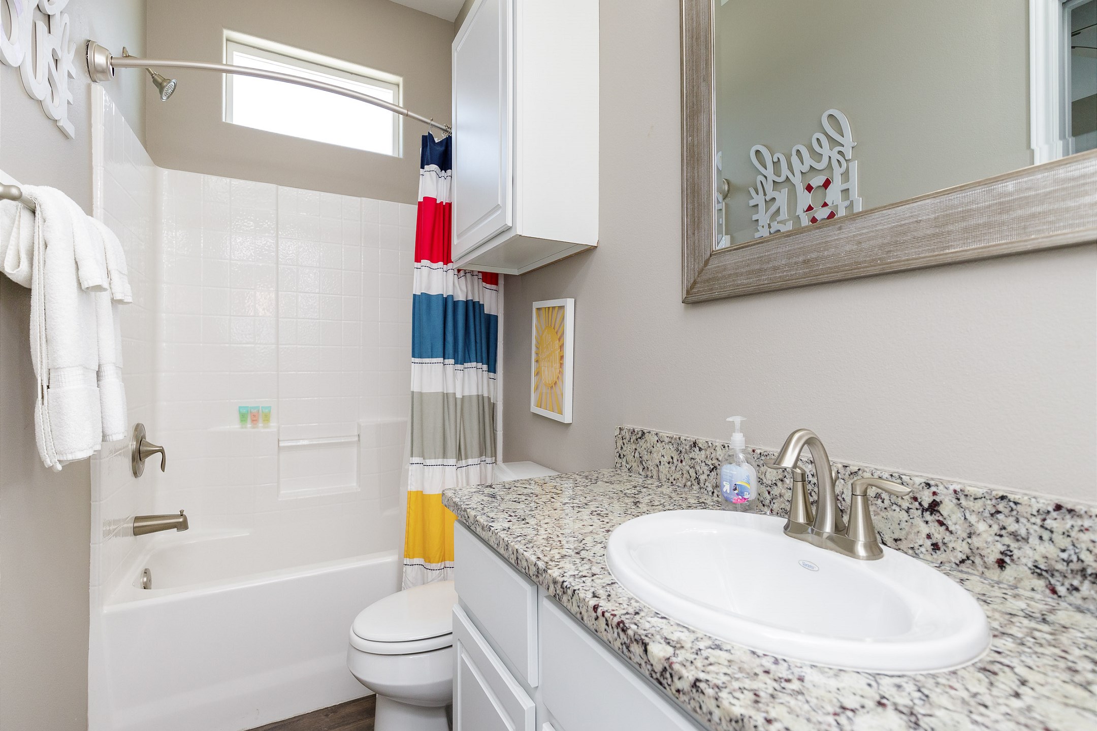 Guest bathroom on the second floor with tub/shower combo that is shared from the third and fourth bedrooms
