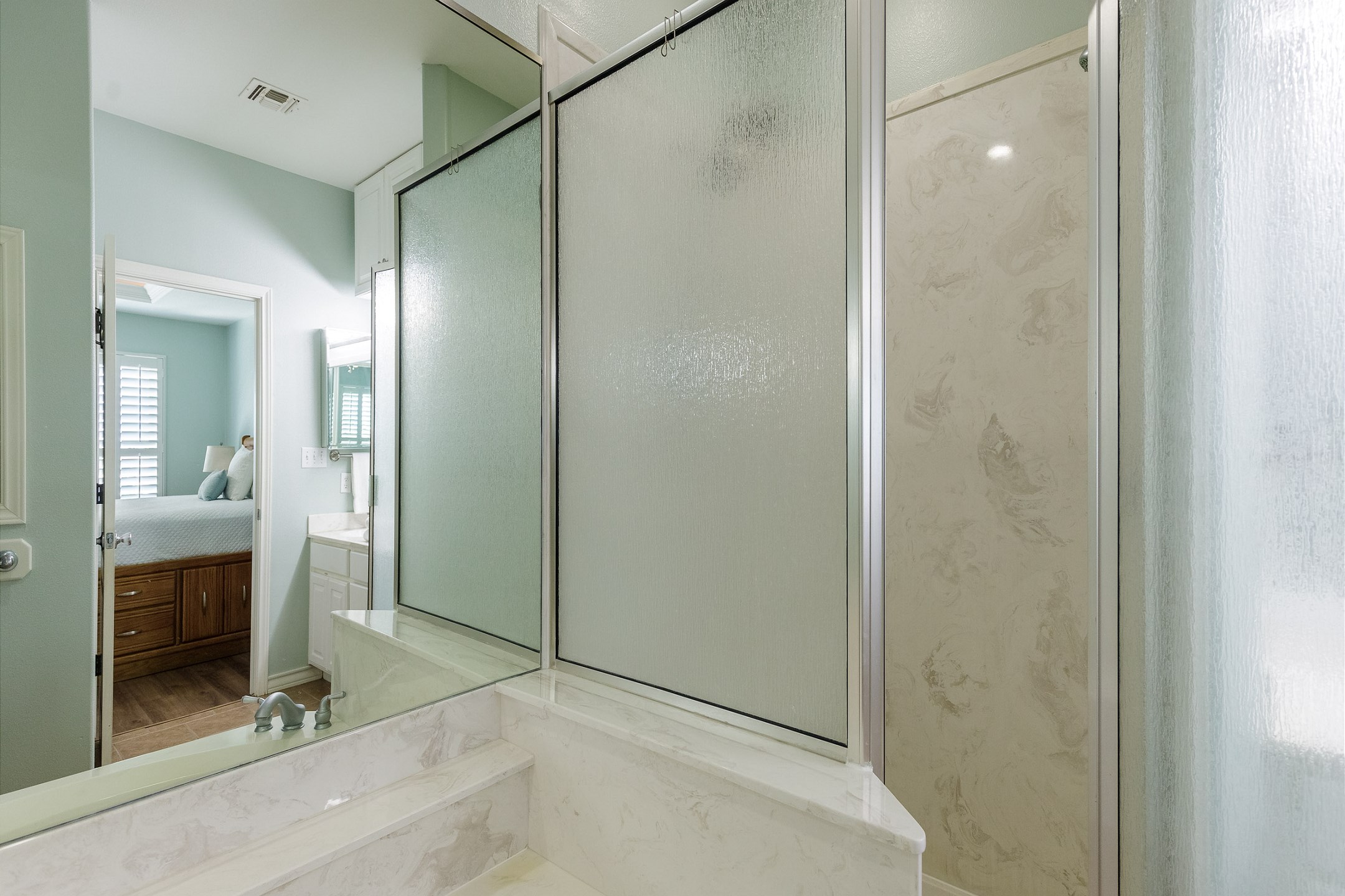 Master bathroom on the third floor with double sinks, walk in shower and garden tub 