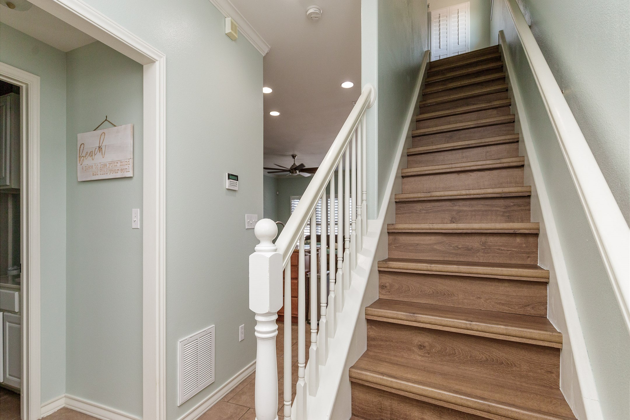 Stairs leading to the two bedrooms on the third floor