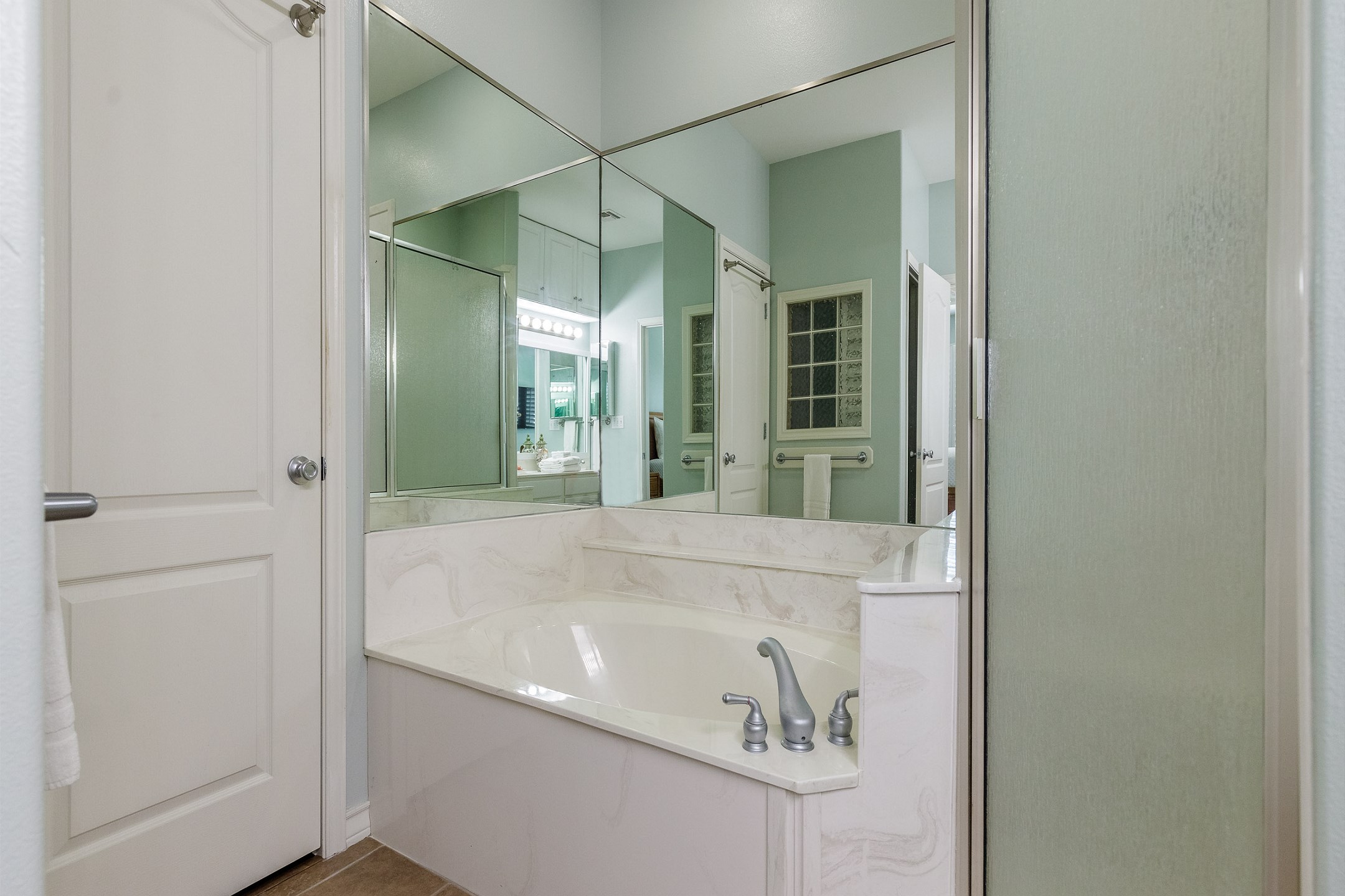 Master bathroom on the third floor with double sinks, walk in shower and garden tub 