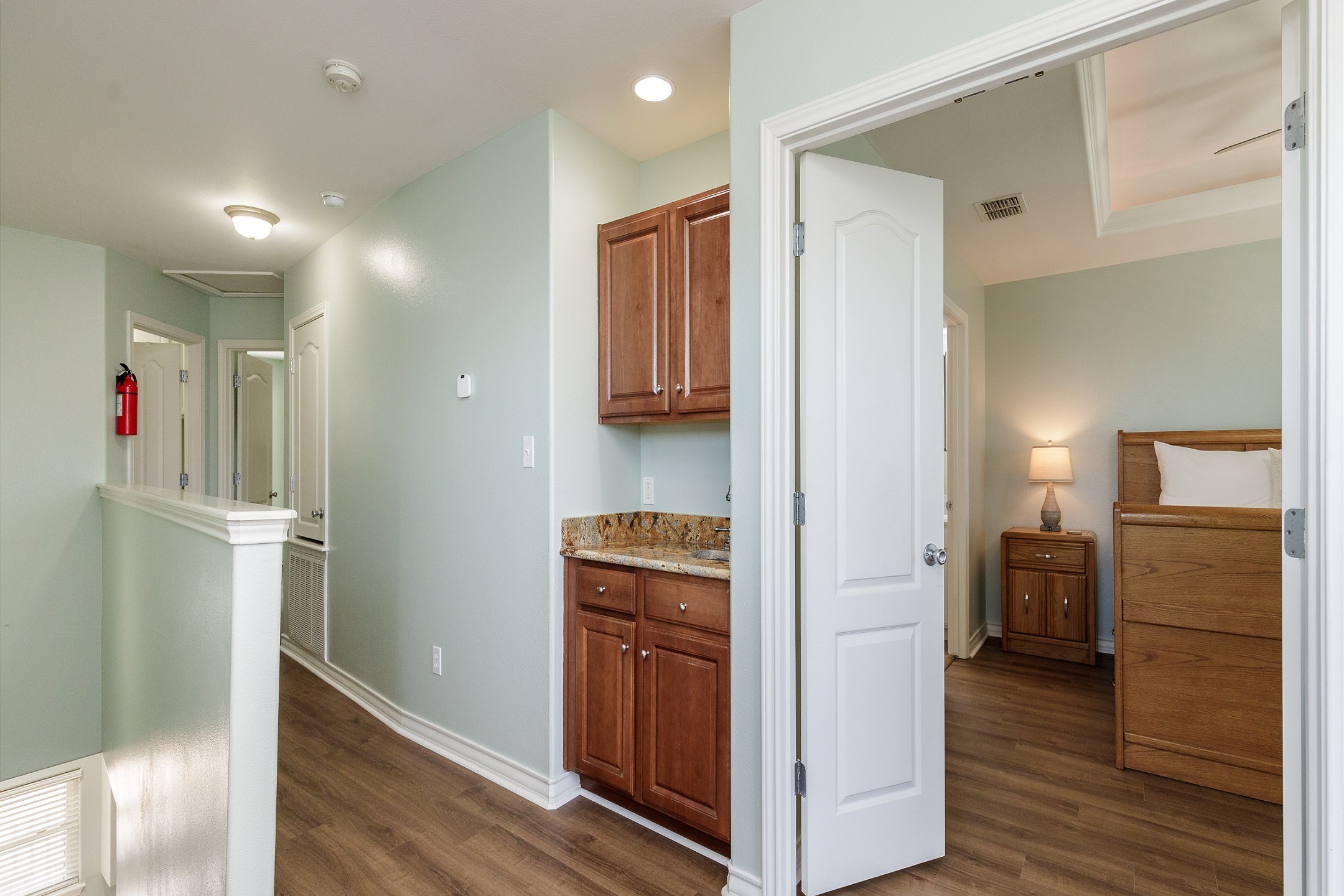 Third floor space with two bedrooms and access to the private balcony overlooking the water