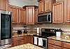 Fully equipped kitchen with stainless steel appliances, beautiful counter tops and plenty of storage 