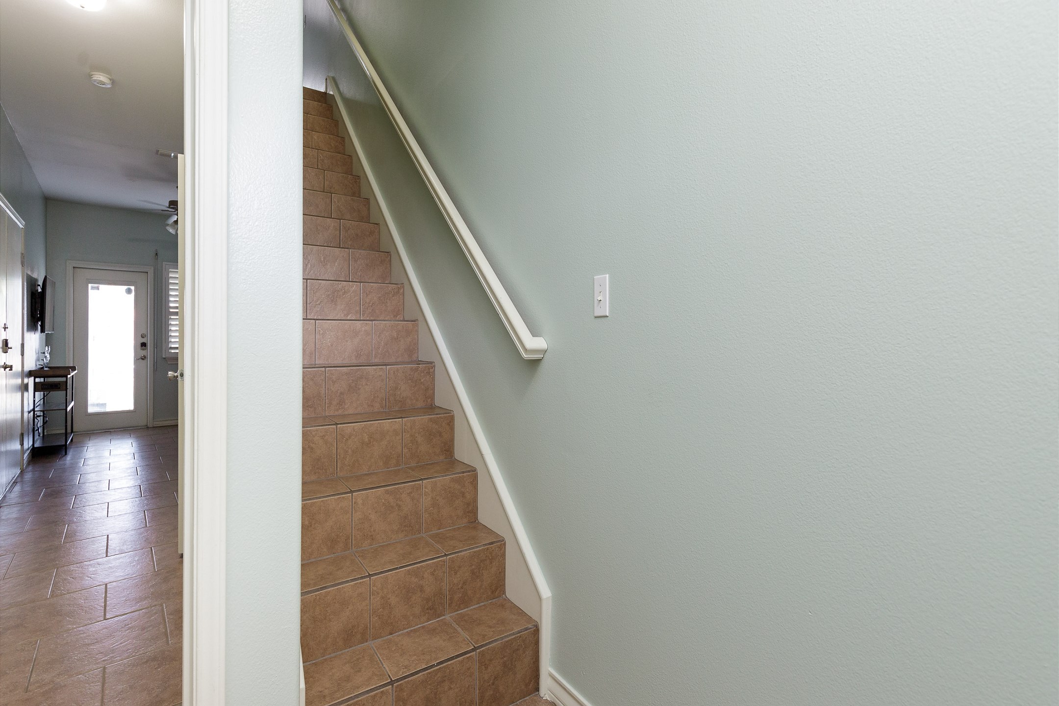 Off the ground level space, head upstairs to the living and kitchen area on the second floor 