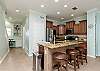 Fully equipped kitchen with stainless steel appliances and large Island