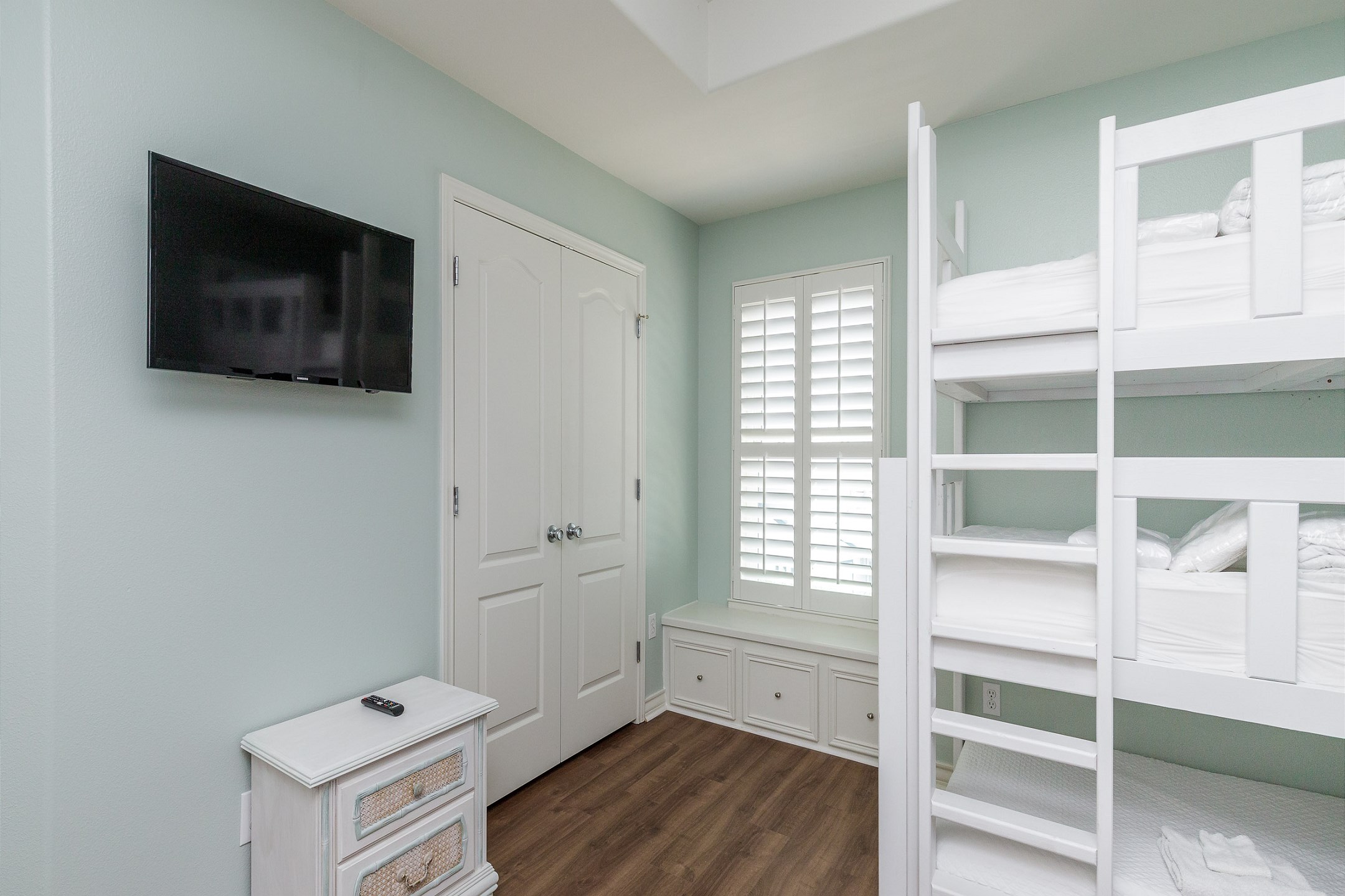The second bedroom on the third floor is a kid''s dream! With six twin-size beds—two sets of built-in bunk beds—plus a private bathroom and flat-screen TV, it’s the perfect space for winding down after a day of adventure