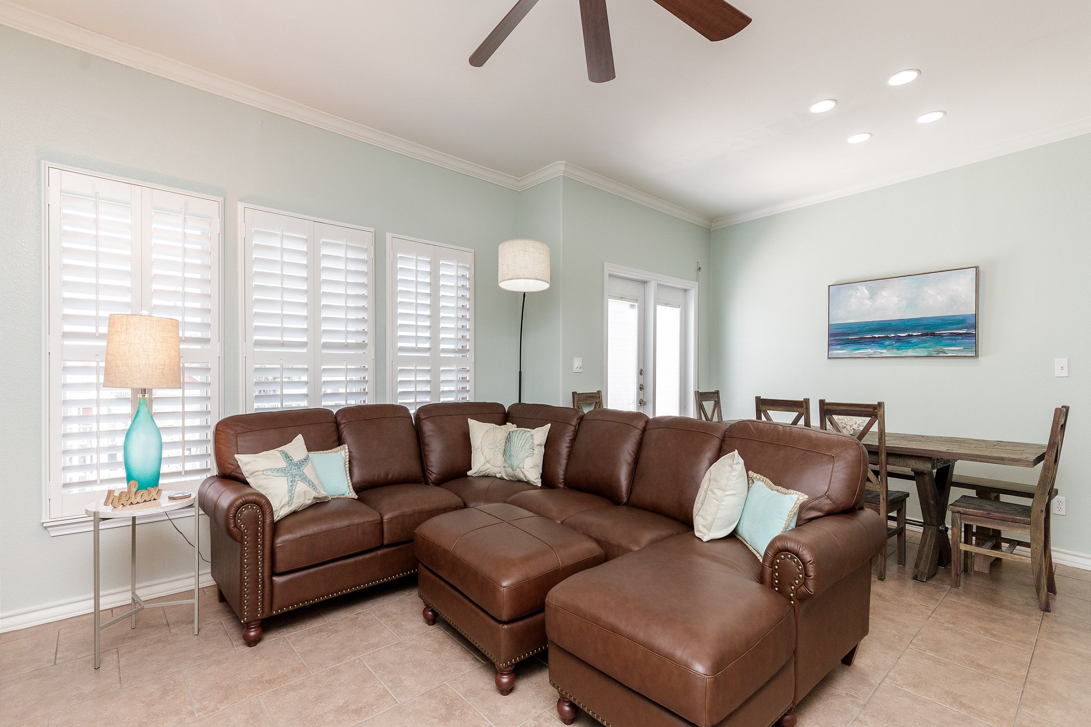 Cozy living space with large sectional for the whole family and access to the private deck on second floor 