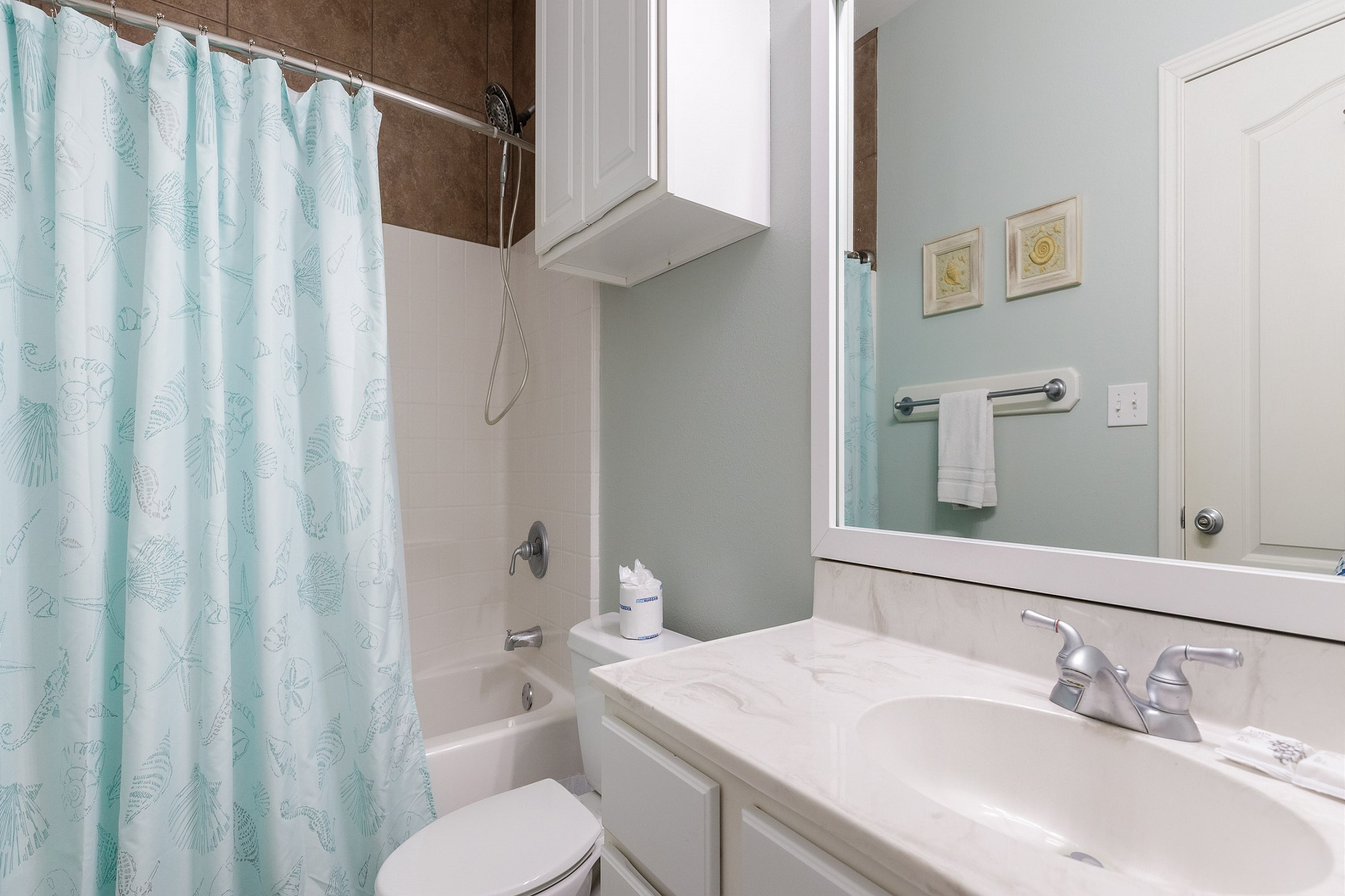 Private bathroom off the second bedroom with tub and shower 