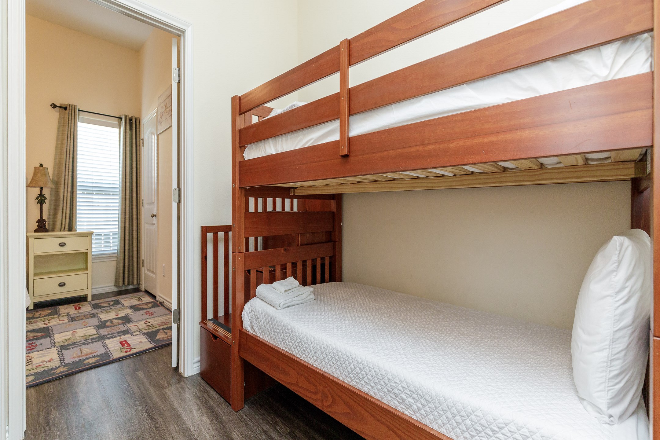Twin size bunk beds in the hallway outside the master bedroom