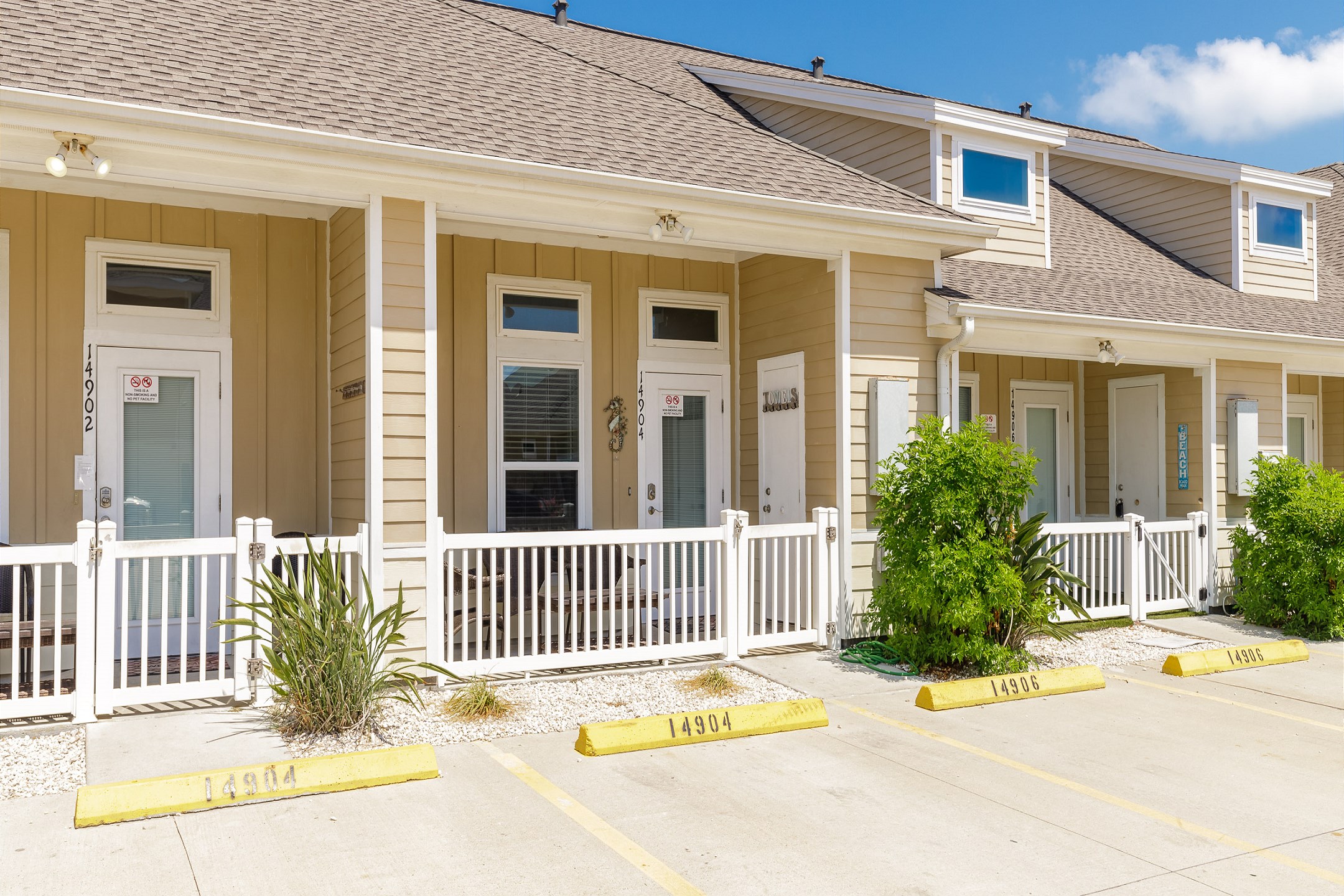 Front view of property with two reserved parking spots 