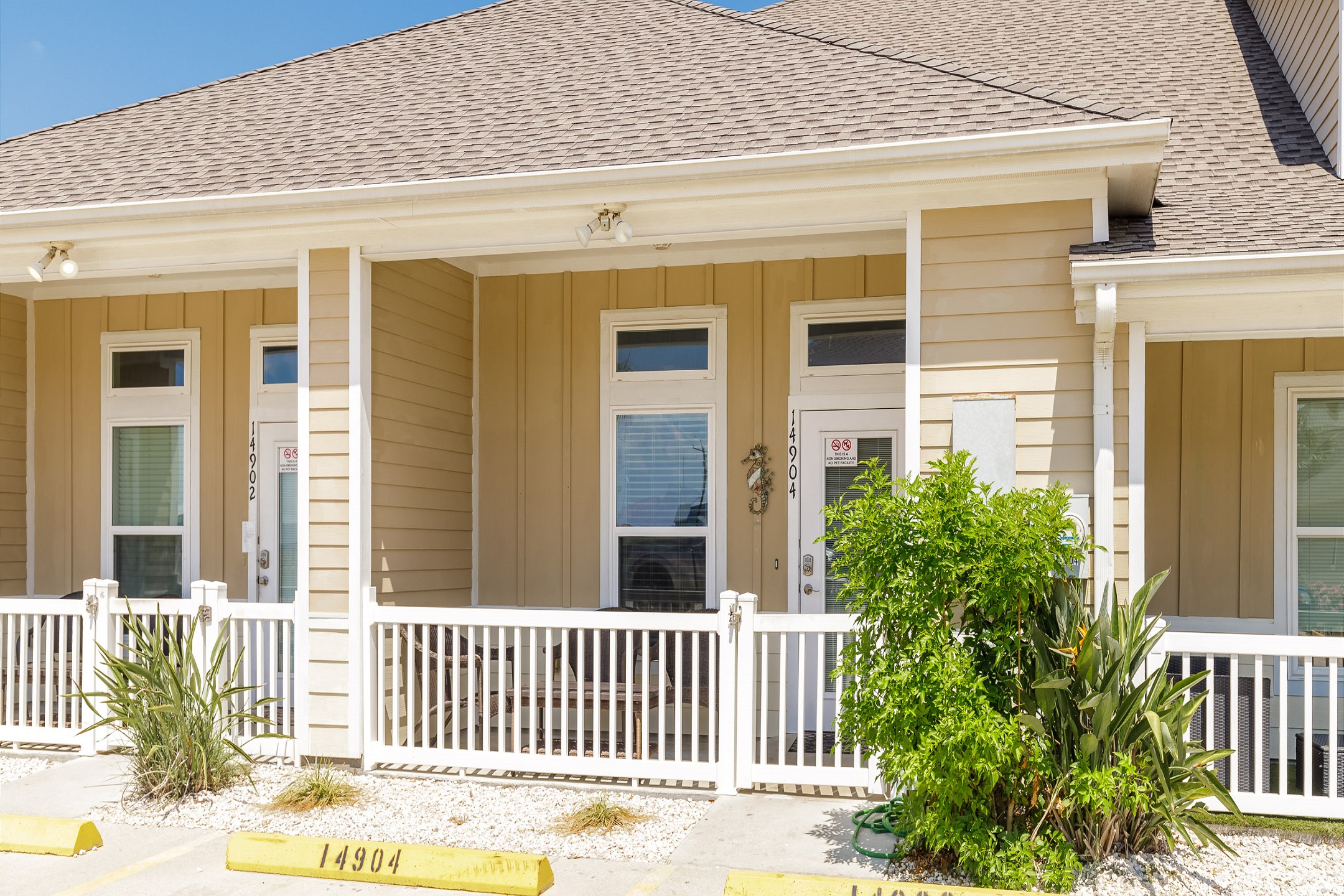 Front view of property with two reserved parking spots 