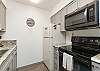 Fully equipped kitchen with beautiful counter tops and plenty of storage