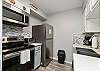 Fully equipped kitchen with stainless steel appliances and everything you need to cook 