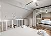 Loft space with queen size bed and private balcony 