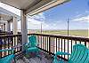 Private balcony off the living area with chairs