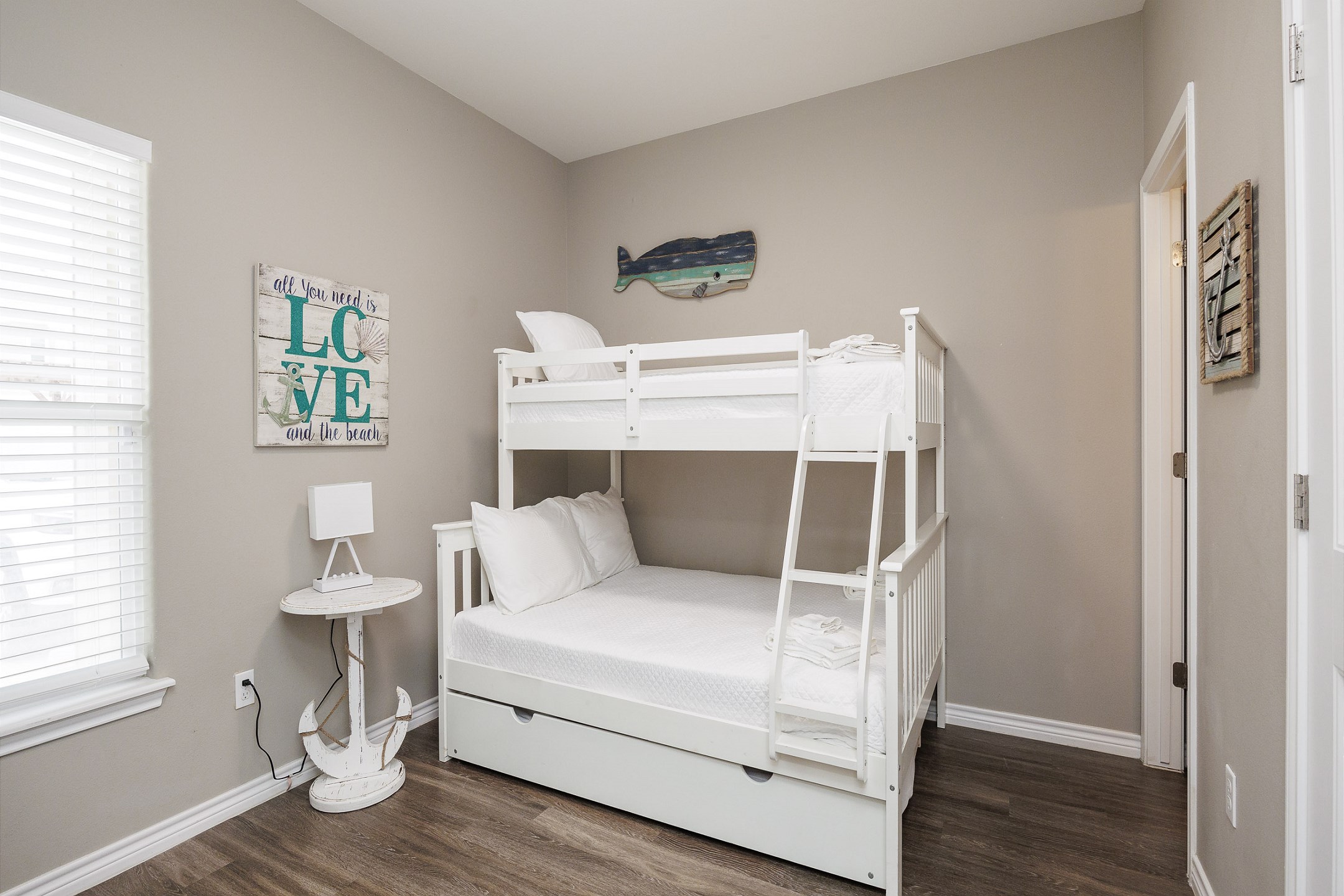 Second bedroom on the first floor with twin over full bunk bed and a pull-out