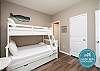 Second bedroom on the first floor with twin over full size bunk bed along with twin trundle and flat screen TV