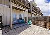 Private fenced in patio with chairs off the master bedroom