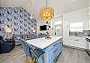 Modern kitchen with large island that looks into the living space 