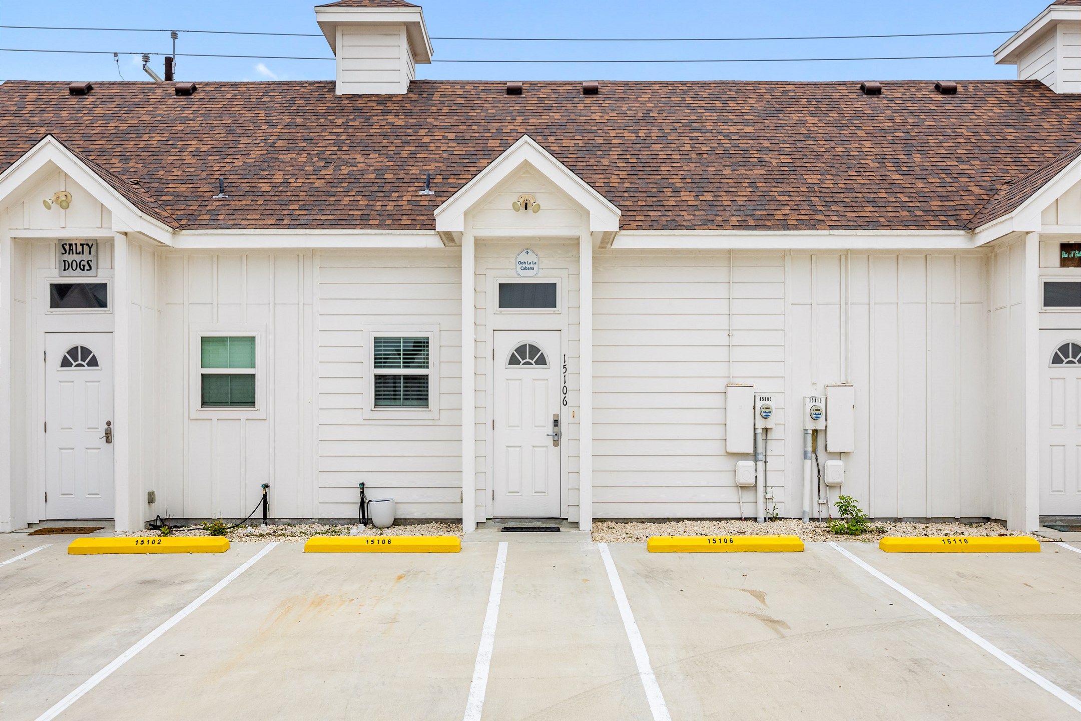 Front exterior of property with two assigned parking spaces 