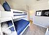 Fourth bedroom with two sets of twin over full bunk beds and flat screen TV 