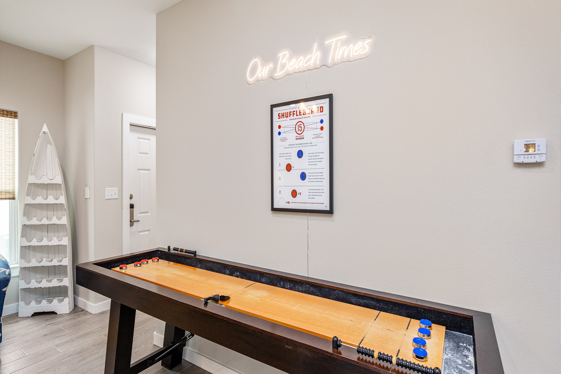 Shuffle board in the living area perfect for family game nights 