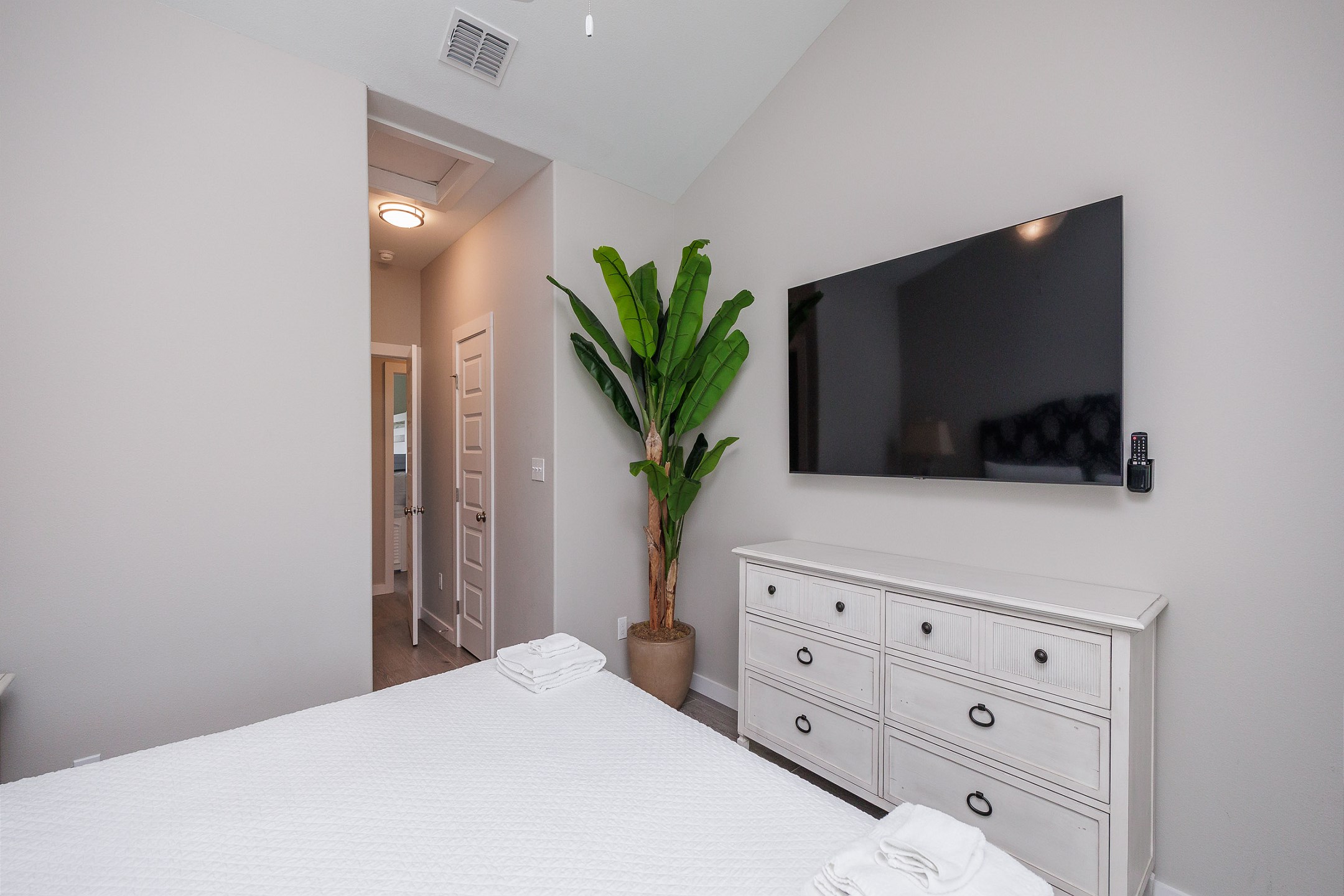 Second bedroom on the second floor with king size bed, private bathroom and flat screen TV