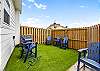 Private turf patio with seating, perfect area for sun bathing or entertaining 