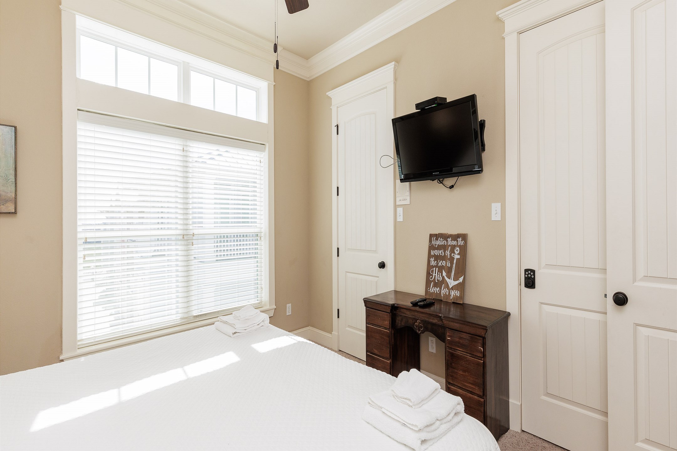 Third bedroom on the third floor with king size bed and flat screen TV