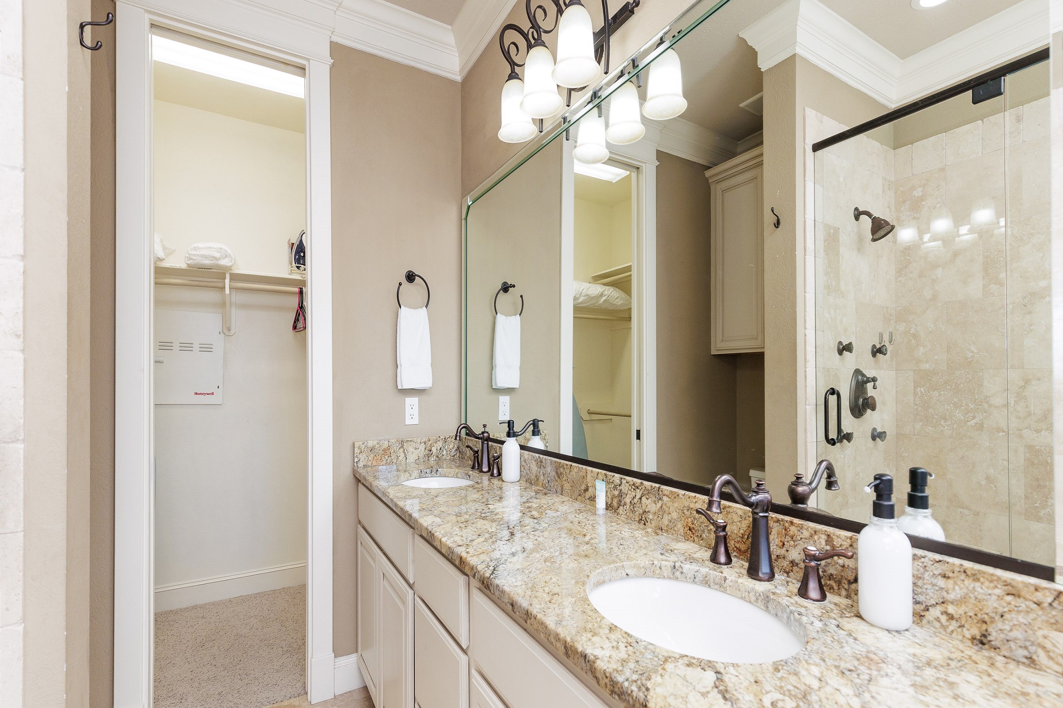 Master bathroom on the second floor with walk in shower, tub, double sinks and walk in closet