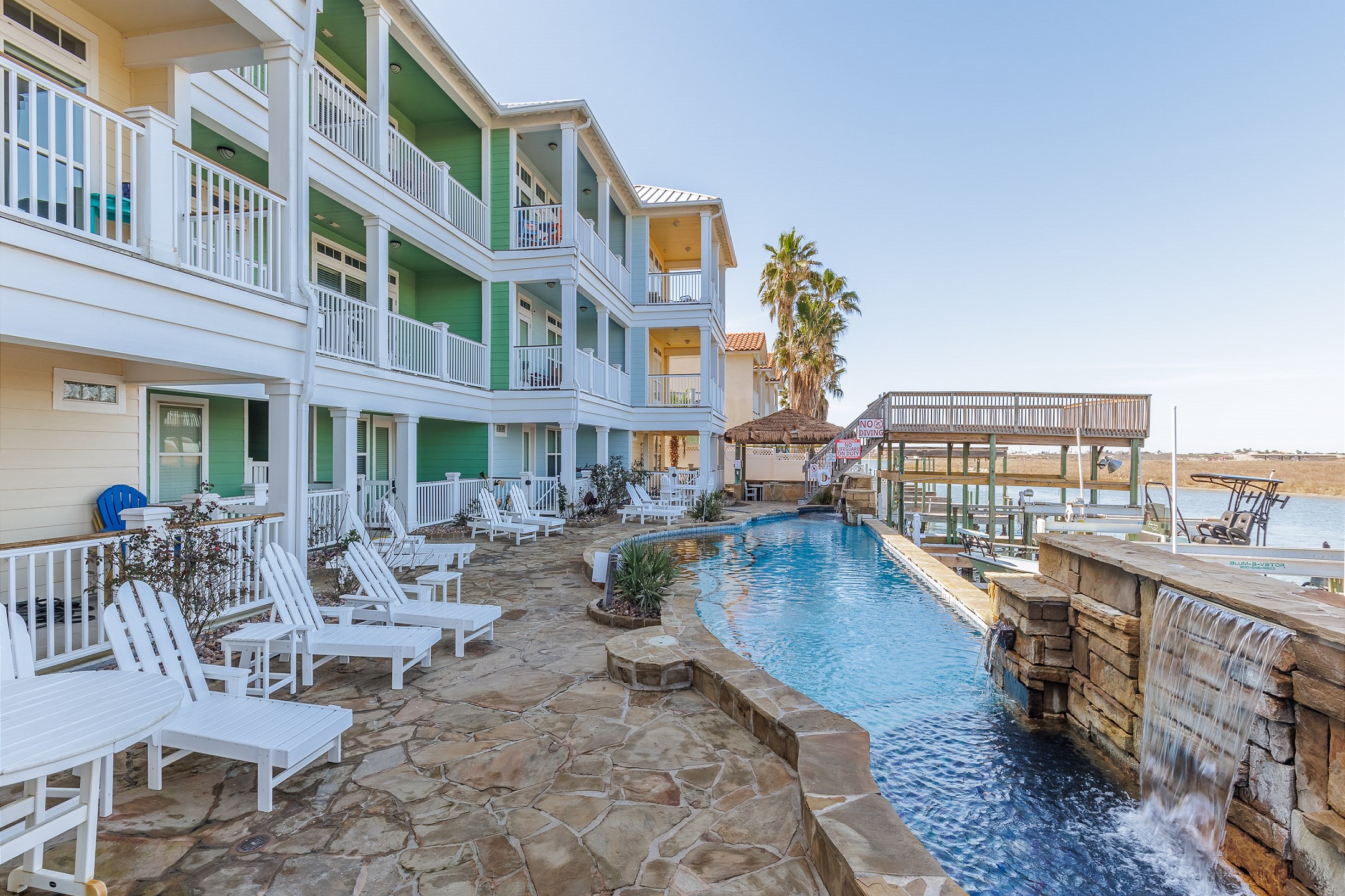 Seating area by the pool overlooking the canal