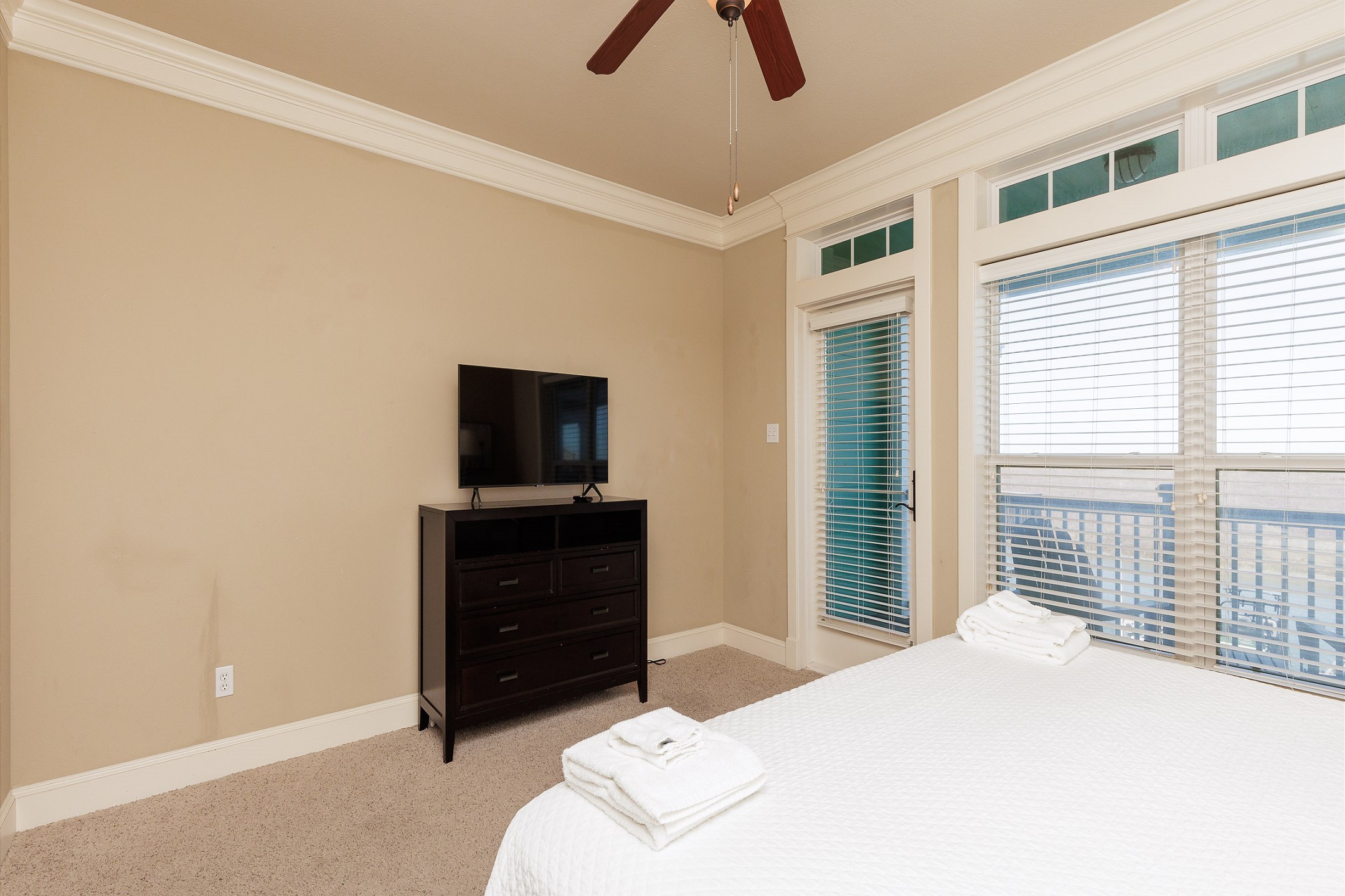 Master bedroom on the second floor with king size bed, private balcony, private bathroom and flat screen TV