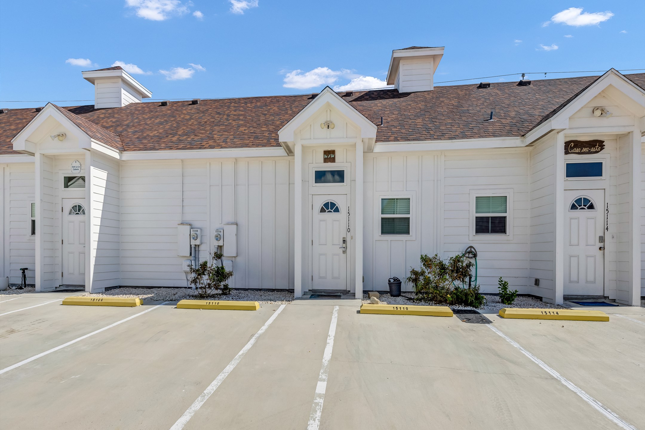 Front exterior of property with two assigned parking spaces 