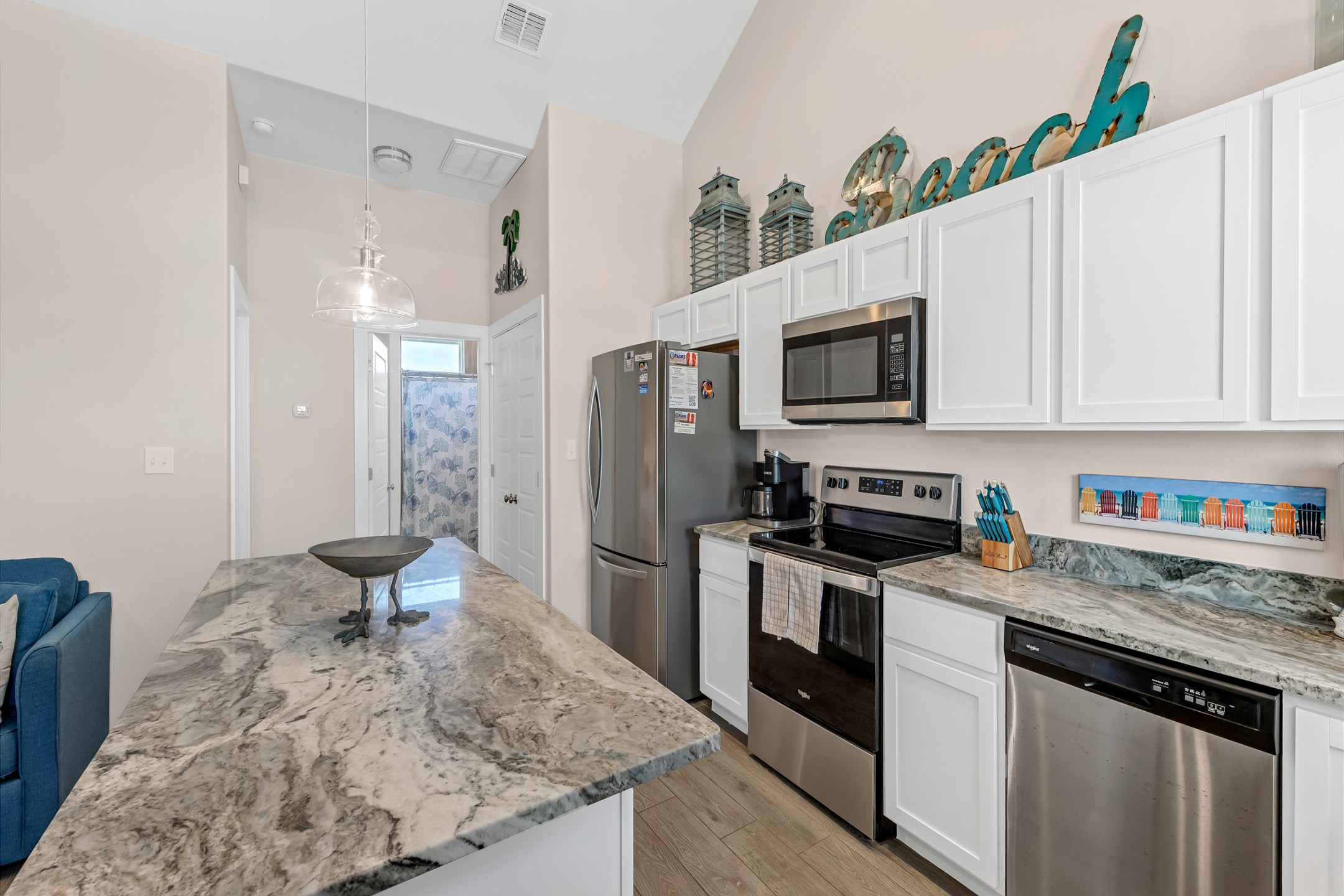 Fully equipped kitchen with unique counter tops and plenty of storage space to cook meals with the family 