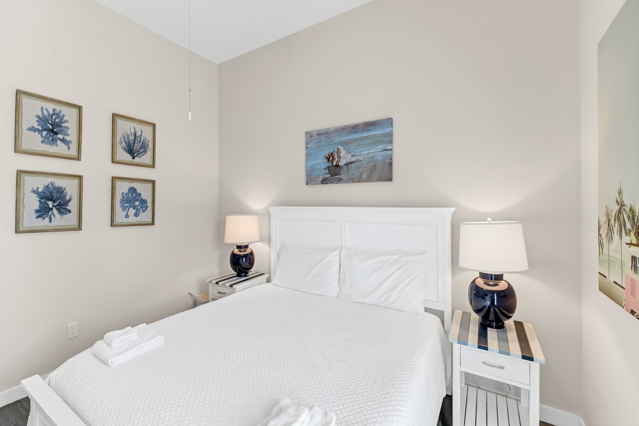 Master bedroom with king size bed, flat screen TV, and back patio access