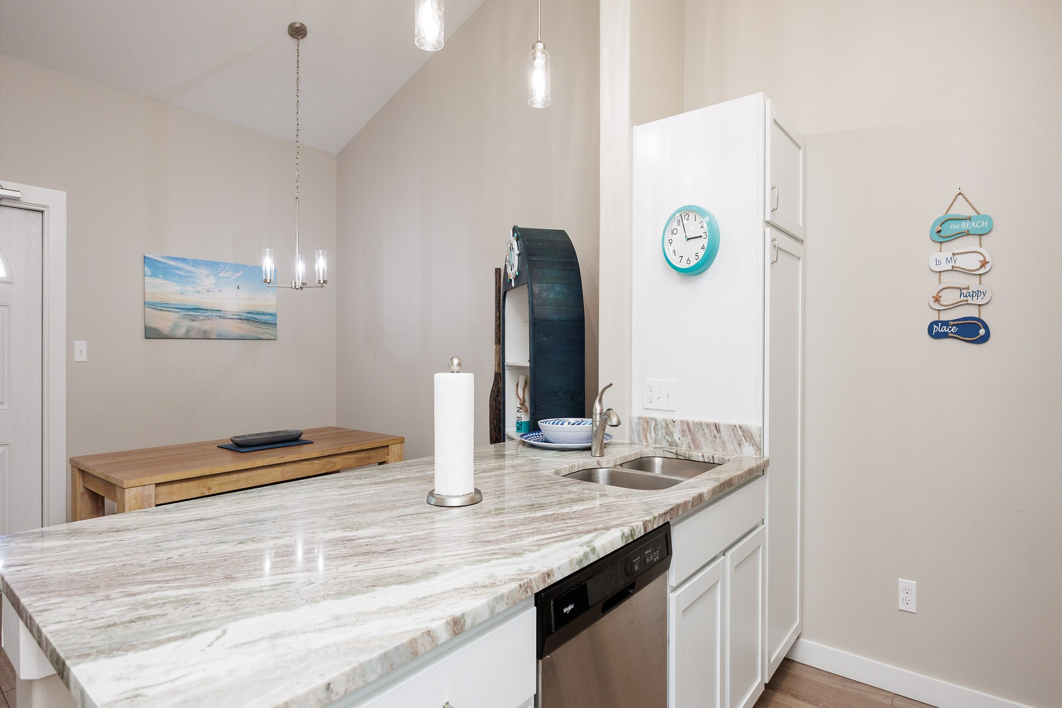 Chic kitchen featuring granite countertops and an expansive layout ideal for cooking and dining