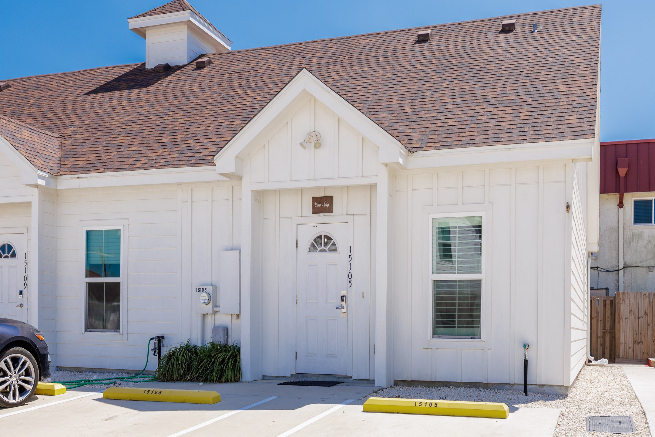 Inviting front view of the property featuring reserved parking conveniently located for easy access